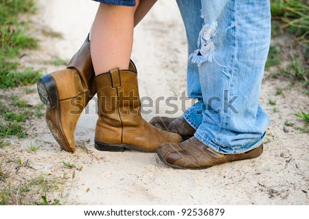 Close up of man and woman with boots and shoes