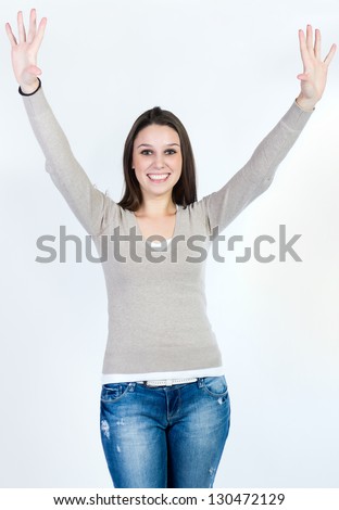 Cheerful woman drawing heart on white background