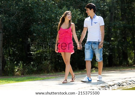 Portrait of attractive couple in countryside.