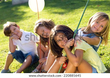 Portrait of group of childrens having fun in the park.