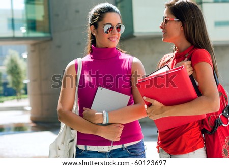 Female college friends talking on campus