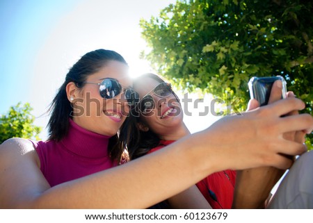 two friends looking at cell phone