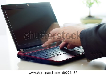 Executive hands typing on laptop