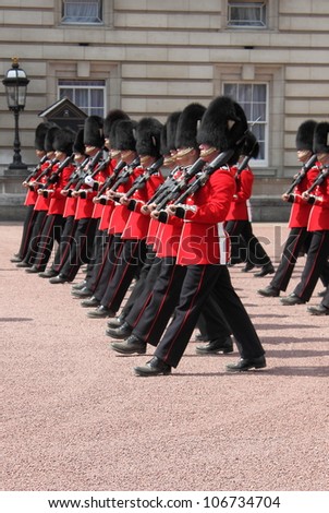LONDON - MAY 21: British Royal guards performs the Changing of the Guard in Buckingham Palace on May 21, 2010 in London, UK