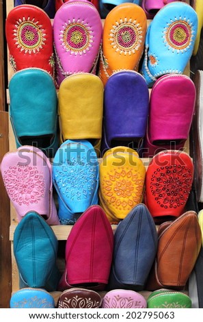 Leather moroccan slippers for sale in a market stall