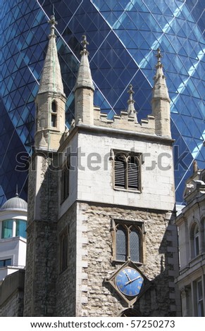 The ancient and the modern (St. Andrew Undershaft church with the Gherkin building in background, London)