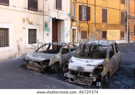 ROME - OCT 15: Devastation of cars by black block groups during the Indignatos demostrations on October 15, 2011 in Rome, Italy