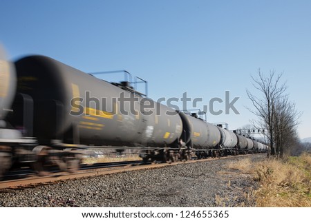 Train of oil tank cars on railroad