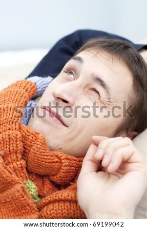 young adult man wake up in the morning and smile. closeup