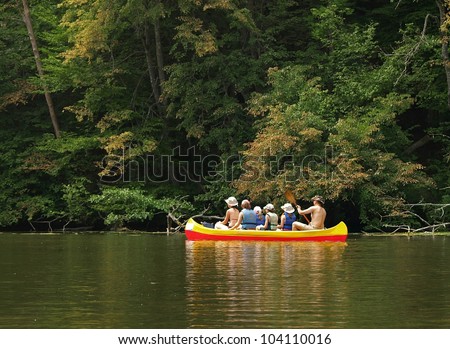 family in canoe on the river