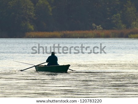 man on boat fishing