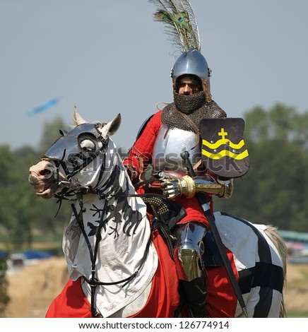 GRUNWALD, POLAND - JULY 18: Show the anniversary of the Battle of Grunwald in 1410, July 18, 2009 on Grunwald fields, Poland. Knight on horse. Polish knight on horseback.