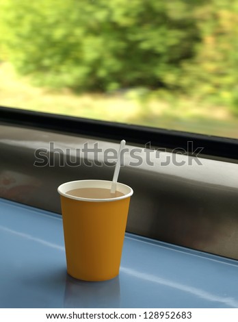 cup of coffee on the table in the train