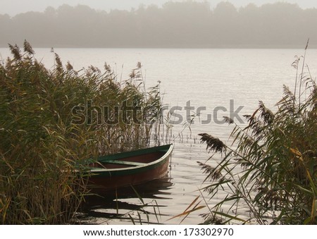 Boat on the foggy lake