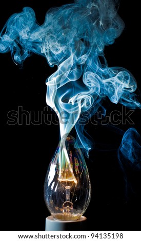 An electical element in a light bulb igniting and burning out