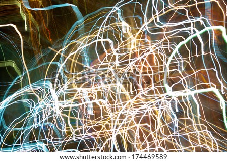 Abstract pattern of city lights from cars, streetlights and bars