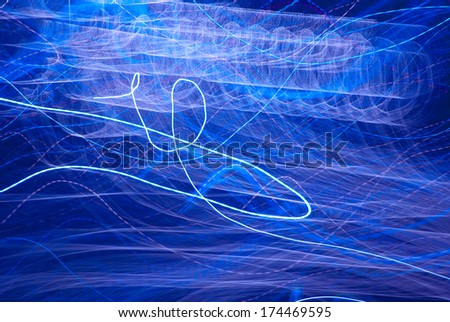 Abstract pattern of city lights from cars, streetlights and bars