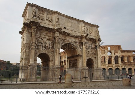 ROME, Italy - SEPTEMBER 27: Arch of Constantine on September 27, 2011 in Rome Italy. Tourists visiting the Arch of Constantine and Colosseum - major touristic attraction in the historic centre of Rome
