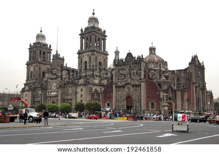 MEXICO CITY, Mexico - NOVEMBER 26: Cathedral Metropolitan on November 26, 2011 Mexico. Cathedral Metropolitan and city traffic in the Zocalo - central square of Mexico city