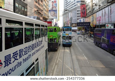 HONG KONG - MARCH 05: Double-decker trams on March 05, 2013 in Hong Kong. Hong Kong tram is the only system in the world run with double deckers, major tourist attraction in Hong Kong