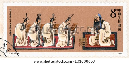 CHINA - CIRCA 1989: A stamp printed in China shows Confucius with his students,commemorate the 2540th anniversary of Confucius\'s birth, circa 1989