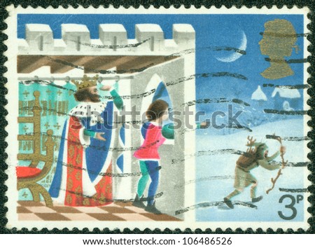 GREAT BRITAIN - CIRCA 1973: a stamp printed in the Great Britain shows Page looking out of window, Illustration for Christmas carol Good king Wenceslas, circa 1973