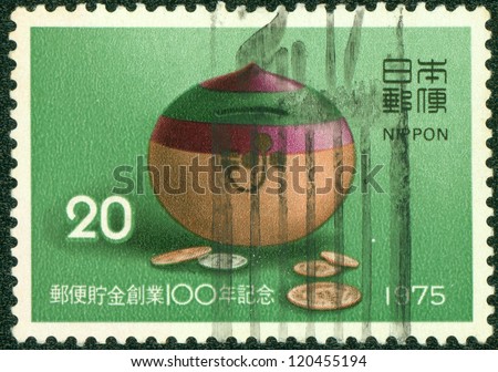 JAPAN - CIRCA 1975: stamp printed by Japan shows Japanese money box, circa 1975