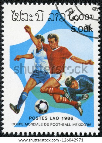 LAOS - CIRCA 1986: A Stamp printed in LAOS shows the Soccer Players on Football Field, with the inscription and name of series \