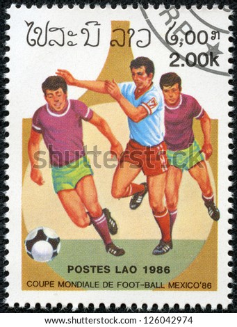 LAOS - CIRCA 1986: A Stamp printed in LAOS shows the Soccer Players on Football Field, with the inscription and name of series \