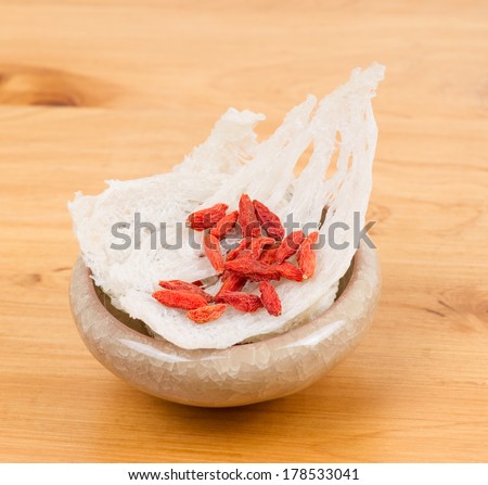 Edible bird s nest with chinese wolfberry fruit on table