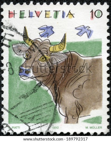 SWITZERLAND - CIRCA 1992: a stamp printed in the Switzerland shows Cow, Bos Taurus, Animal, circa 1992