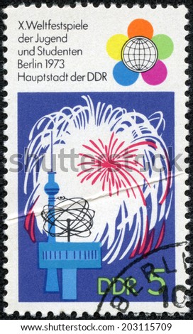 GDR - CIRCA 1973: a stamp printed in GDR shows Festival Emblem, Fireworks, TV Tower, World Clock, 10th Festival of Youths and Students, Berlin, circa 1973