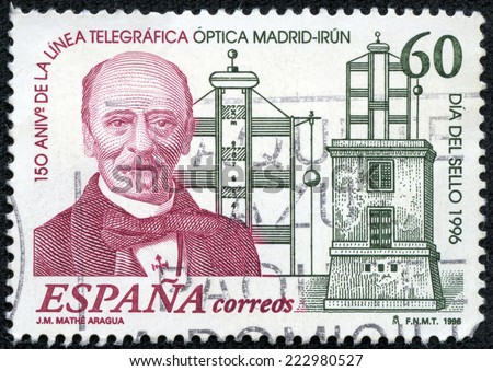 SPAIN - CIRCA 1996: A stamp printed in Spain shows Jose Mathe Aragua (General Director) and Telegraph Tower honoring 150th Anniversary of Madrid - Irun Telegraph Signal Line, circa 1996