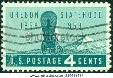 UNITED STATES OF AMERICA - CIRCA 1959: Stamps printed in United State of America with image of a covered stagecoach wagon & Mt. Hood to commemorate Oregon Statehood, circa 1959.