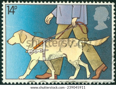 GREAT BRITAIN - CIRCA 1981: a stamp printed in the Great Britain shows Guide Dog Leading Blind Man, International Year of the Disabled, circa 1981