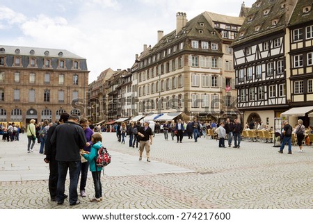 STRASBOURG, FRANCE - SEPTEMBER 12, 2010: The cathedral square in the historical centre of Strasbourg, France. It is the square around Strasbourg\'s cathedral. The square is always filled with tourists.