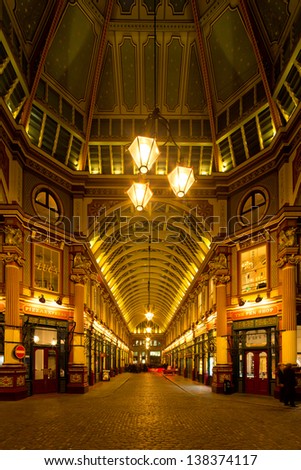 LONDON - MARCH 8: Night shot of people drink after work in the covered Leadenhall Market, one of the tourist attractions in London. London, UK, March 8, 2013.