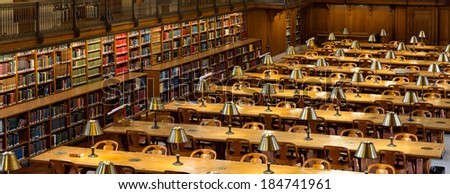 NEW YORK, USA - MARCH 14: Lights on tables and books aside in the historical Rose Main Reading Room in New York Public Library NYPL , on March 14, 2014 in New York, USA.