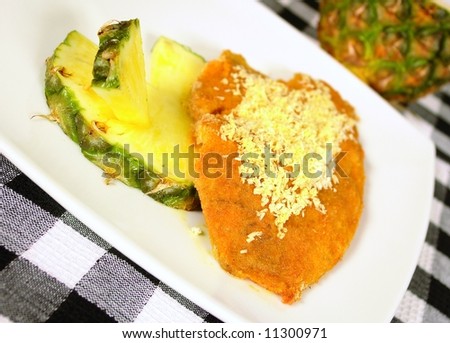 Breaded fish with pineapple