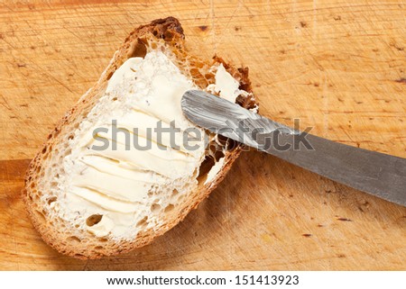 Slice of bread spread with butter