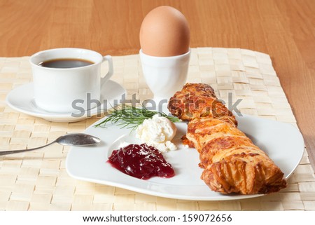 Light meal with coffee, bread and jam.