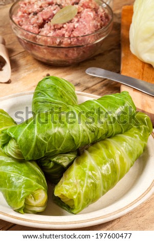 Cabbage rolls stuffed with meat and grits prepared for cooking.