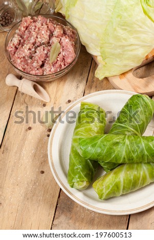 Cabbage rolls stuffed with meat and grits prepared for cooking.