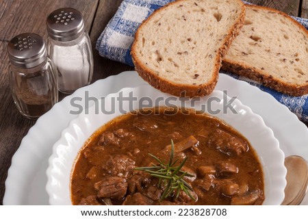 Goulash soup with pork and mushrooms. Selective focus.