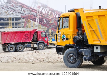 SOCHI,  RUSSIA - APRIL 29: Trucks on the construction of the main stadium with a capacity of 45,000 people on April 29, 2012 in SOCHI, RUSSIA. The cost of the project - 15.5 billion rubles.