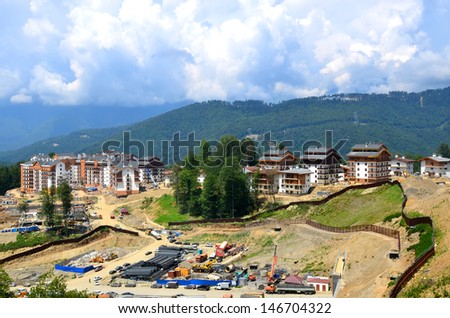 SOCHI,RUSSIA - JULY 10:Construction of new hotels in the mountain Olympic village on July 10, 2013 in Sochi, Russia. Capacity will reach 2,600 people. The Olympic village covers an area of 32 hectares