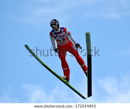 Sochi, Russia - December 9, 2012: Fis Ski Jumping World Cup In Sochi On Tramplin Complex &Quot;Russki Gorki&Quot;. Unidentified Athlete In Flight.