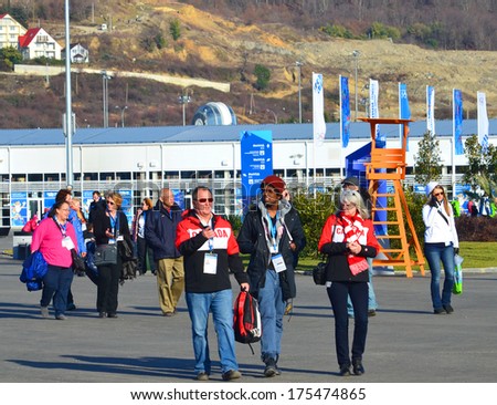 SOCHI, RUSSIA - FEBRUARY 7, 2014: Fans and volunteers at the entrance to the Olympic Park a few hours before the opening ceremony of the Olympic Games 2014