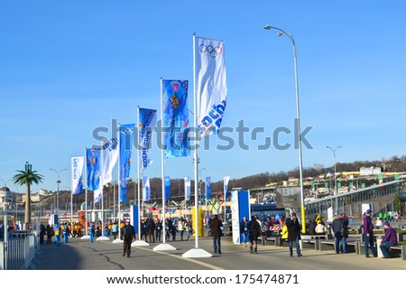 SOCHI, RUSSIA - FEBRUARY 7, 2014: Fans and volunteers at the entrance to the Olympic Park a few hours before the opening ceremony of the Olympic Games 2014
