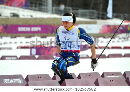 SOCHI, RUSSIA - March 9, 2014: Lyudmila Pavlenko (Ukraine) competes on Winter Paralympic Games  in Sochi. Biathlon, Women\'s 12,5 km, sitting